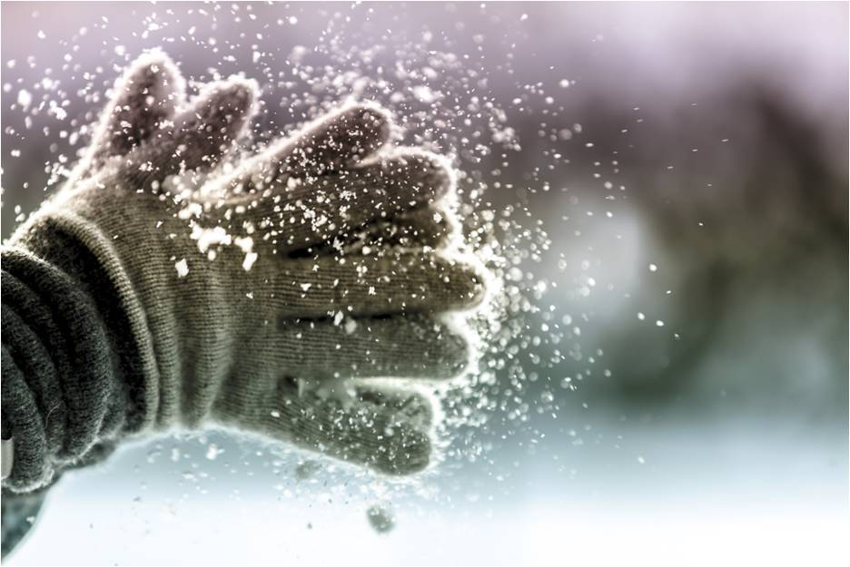 Hands with gloves playing snow