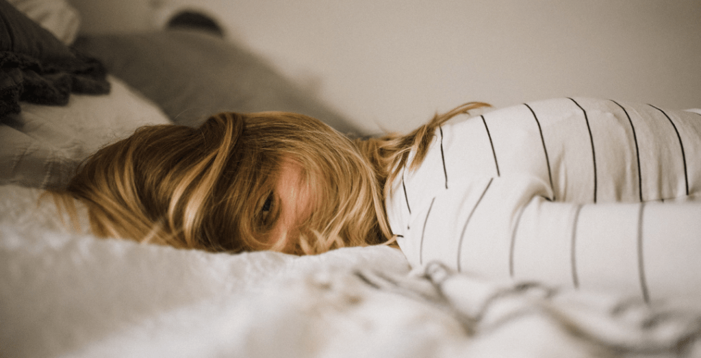 woman lying on bed