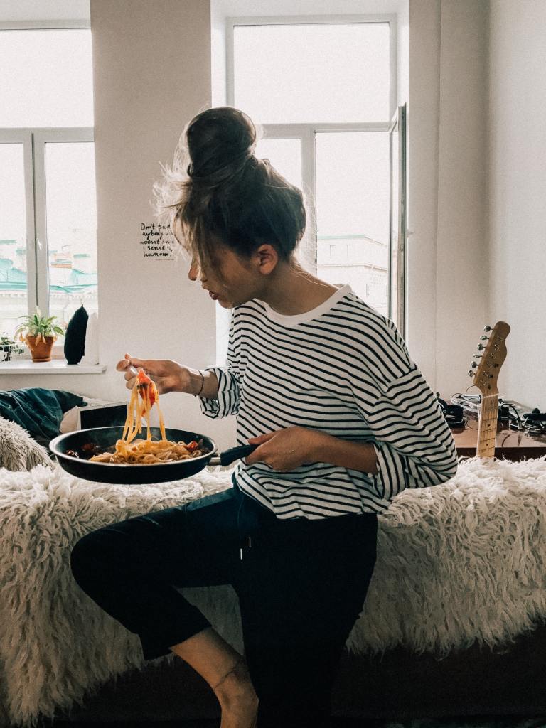 Woman eating noodles