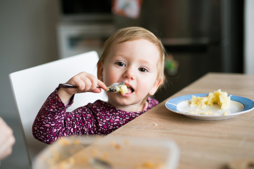 Kids eating potatoes