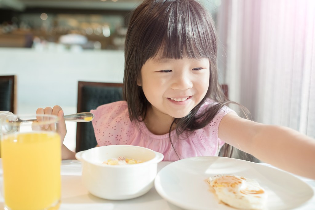 Smiling kid while eating